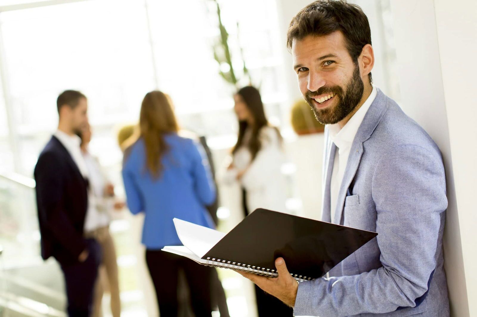 Young businessman with files
