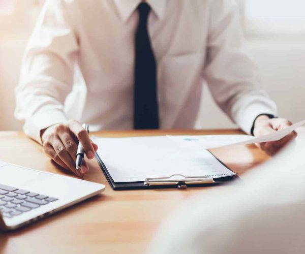 man submit resume to employer to review job application.